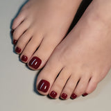 Burgundy Toe squoval Toenails Kit press-on nails worn on a hand