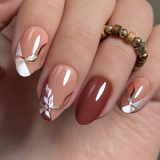Elegant Flow short almond press-on nails worn on a hand