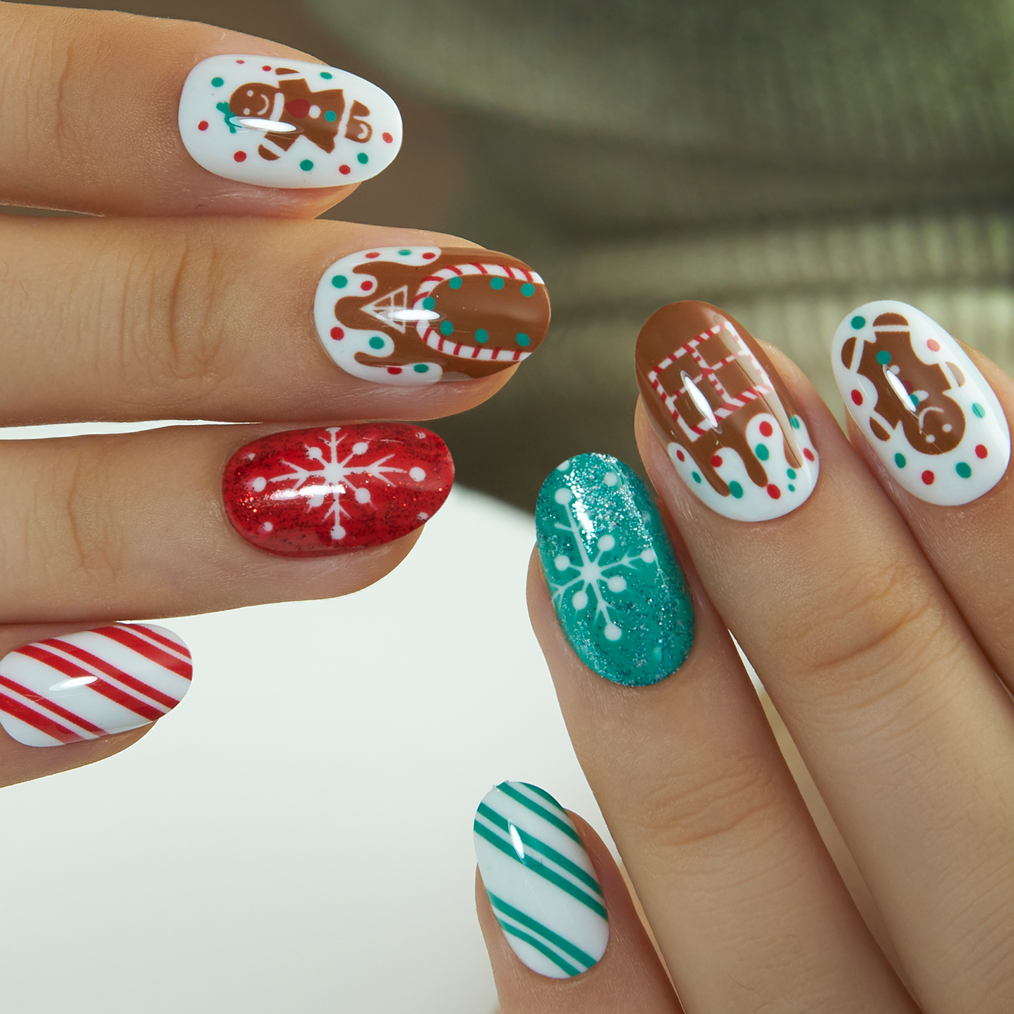 Gingerbread Spark short oval Ver 2 press-on nails worn on a hand